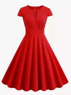 Robe glamour vintage style années 50 col rond manches courtes découpées coupe trapèze moyenne