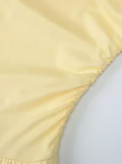 Robe jaune sexy mini à lacets sans manches dos nu et bretelles.