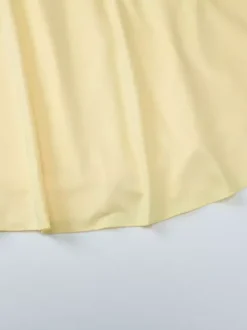 Robe jaune sexy mini à lacets sans manches dos nu et bretelles.