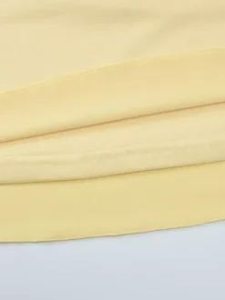 Robe jaune sexy mini à lacets sans manches dos nu et bretelles.