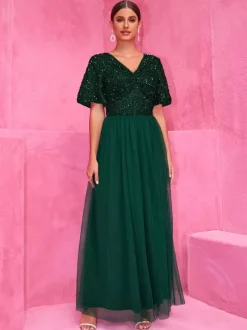Robe longue de soirée vert foncé à paillettes et fente haute pour soirées 2026