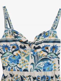 Robe longue d'été fluide à bretelles spaghetti et imprimé floral bleu pour femme avec n艙ud sur le devant et volants.