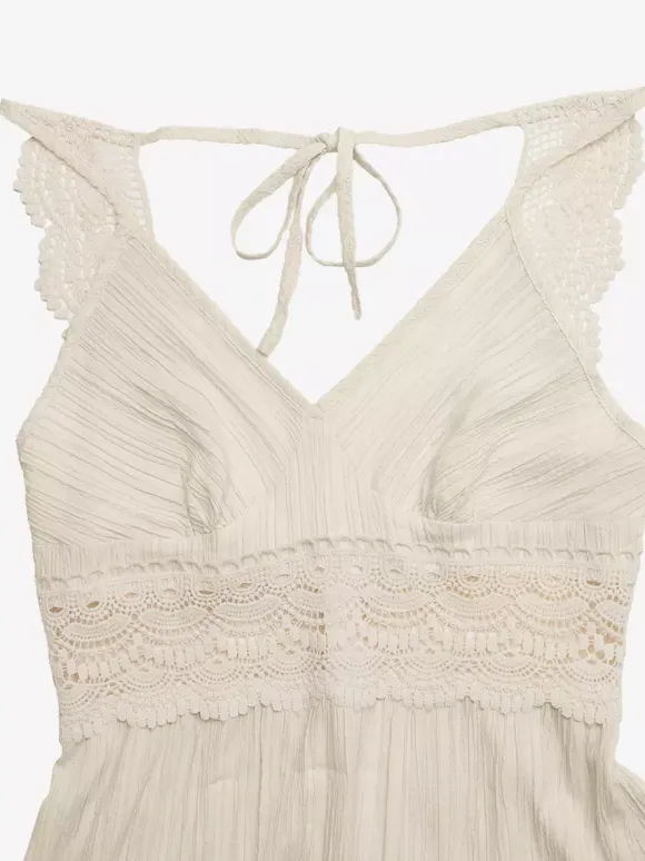 Robe longue fluide d'été pour femme couleur crème avec bretelles spaghetti et taille en dentelle blanche col en V.