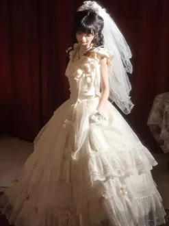 Robe longue Lolita fée blanche à lacets et n艙uds ornée de fleurs idéale pour un goûter.