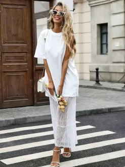 Robe maxi chic en dentelle noire à manches courtes et col rond sans taille idéale pour tous les jours.
