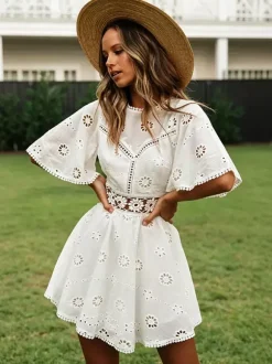 Robe mini dos nu à 艙illets blancs pour femme - Robe d'été bohème en coton coupe évasée et manches bouffantes - Idéale pour les vacances d'été à la plage 2026