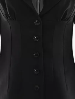 Robe mini moulante à épaules rembourrées et fronces style blazer moderne collection femme 2026