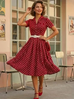 Robe rétro glamour style années 50 col rabattu boutons manches courtes robe trapèze à pois