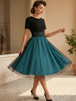 Robe rétro glamour style années 50 col rond manches courtes superposées taille moyenne à pois style rockabilly