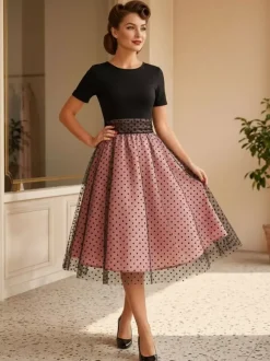 Robe rétro glamour style années 50 col rond manches courtes superposées taille moyenne à pois style rockabilly