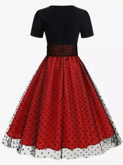 Robe rétro glamour style années 50 col rond manches courtes superposées taille moyenne à pois style rockabilly
