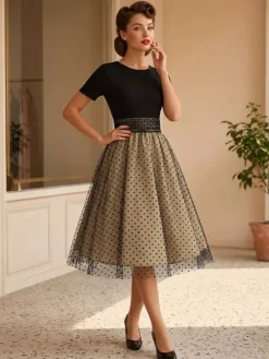 Robe rétro glamour style années 50 col rond manches courtes superposées taille moyenne à pois style rockabilly