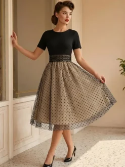 Robe rétro glamour style années 50 col rond manches courtes superposées taille moyenne à pois style rockabilly