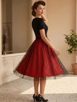 Robe rétro glamour style années 50 col rond manches courtes superposées taille moyenne à pois style rockabilly