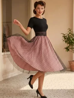 Robe rétro glamour style années 50 col rond manches courtes superposées taille moyenne à pois style rockabilly