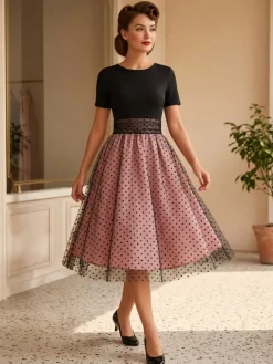 Robe rétro glamour style années 50 col rond manches courtes superposées taille moyenne à pois style rockabilly