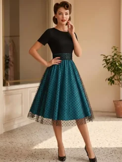 Robe rétro glamour style années 50 col rond manches courtes superposées taille moyenne à pois style rockabilly