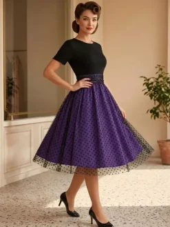 Robe rétro glamour style années 50 col rond manches courtes superposées taille moyenne à pois style rockabilly