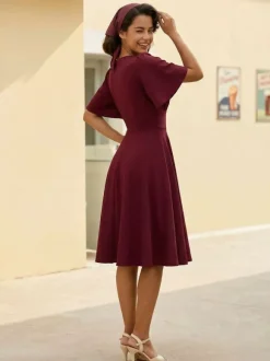 Robe rétro swing pour femme col en V froncée sur le devant boutons décoratifs manches papillon collection 2026