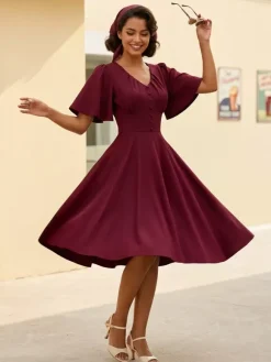 Robe rétro swing pour femme col en V froncée sur le devant boutons décoratifs manches papillon collection 2026