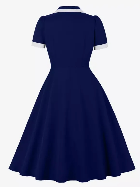 Robe rétro trapèze à col à revers contrasté et double poche pour femme (collection 2026)
