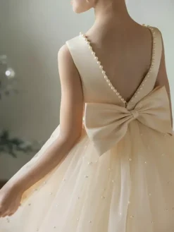 Robes de demoiselle d'honneur de mariage Robes d'occasion spéciale Champagne Perles sans manches