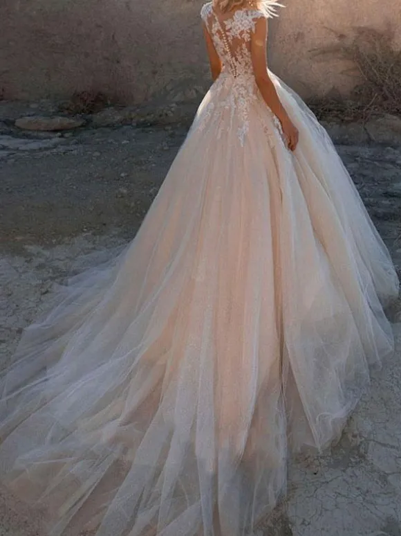 Robes de mariées princesses à traîne en mousselines dos transparent boutonné sur dos Robe mariée vaporeuse
