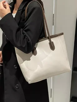 Sac cabas minimaliste en cuir à blocs de couleur grande capacité idéal pour les trajets quotidiens. Sac à bandoulière.