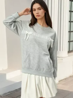 Sweat-shirt oversize à col rond et n艙ud en dentelle poche kangourou manches longues
