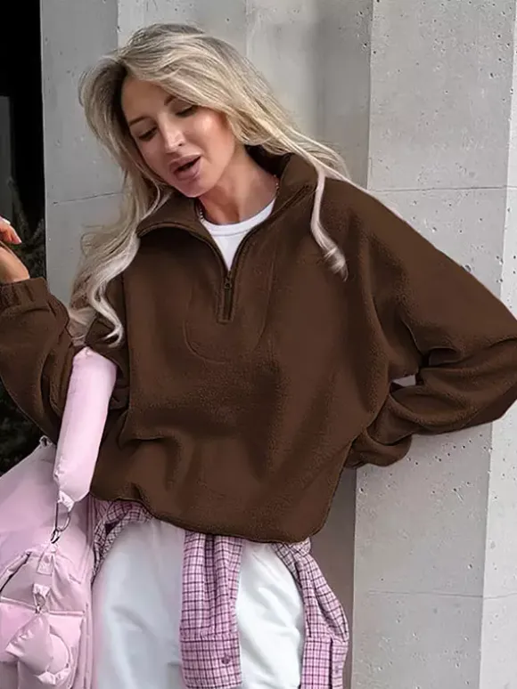 Sweat-shirt doux et duveteux à demi-zip coupe ample poignets côtelés manches longues idéal pour un look décontracté au quotidien.