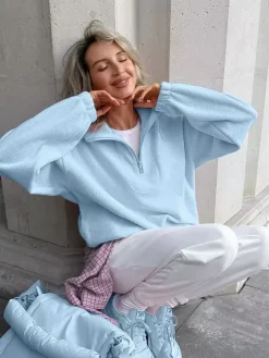 Sweat-shirt doux et duveteux à demi-zip coupe ample poignets côtelés manches longues idéal pour un look décontracté au quotidien.