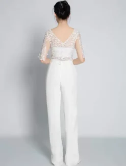 Tenue de mariée deux pièces haut en dentelle dos en V décoré des boutons pantalon en crêpe élastique