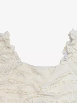 Top d'été blanc crème à col en V buste froncé et ourlet évasé smocké