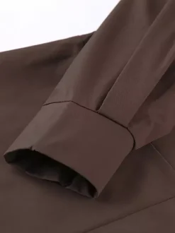 Trench-coat ceinturé pour femme - Col montant chic épaulettes coupe ajustée et péplum - Collection streetwear printemps 2026 au luxe discret
