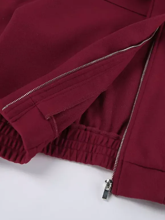 Veste bomber courte rouge bordeaux à col minimaliste fermeture éclair intégrale et poignets élastiques